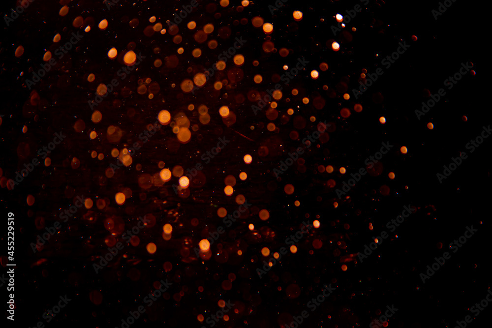 Abstract gold bokeh on black background