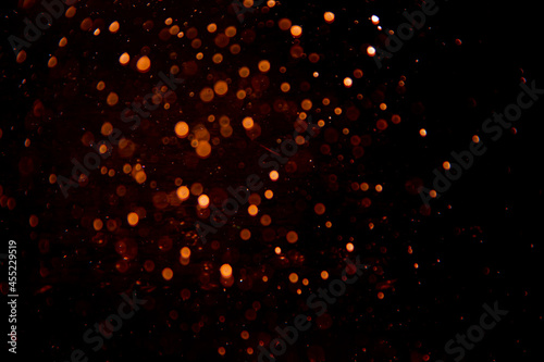 Abstract gold bokeh on black background