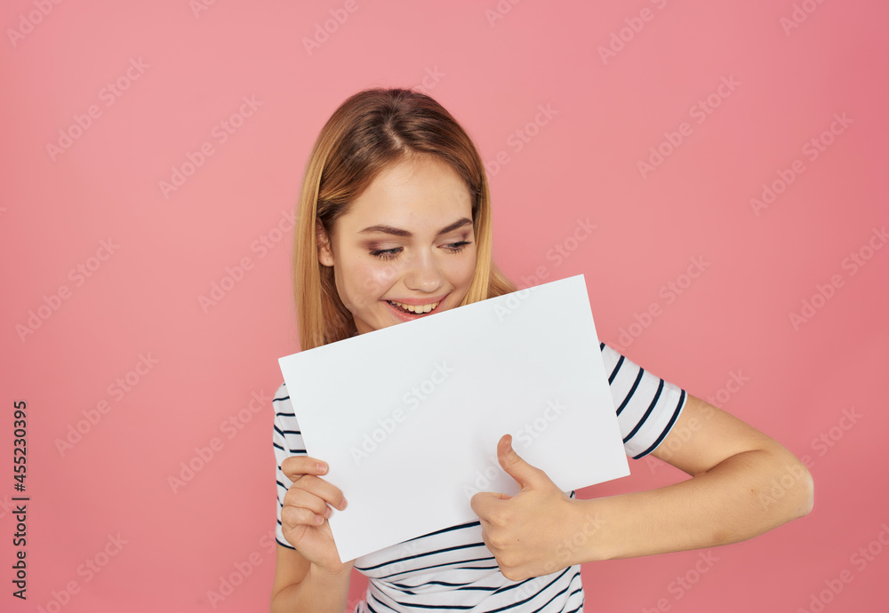 blonde woman in a striped T-shirt with a white sheet in hand banner Copy space blonde woman in a striped T-shirt with a white sheet in hand banner Copy space
