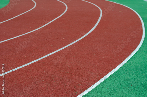 Empty running tracks. Red jogging tracks at the stadium. Sports, active lifestyle. Selective focus. © Mikhail