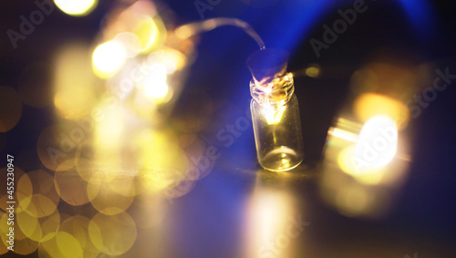 Christmas garland of glass bottles. New year and christmas concept. A garland of light bulbs with a beautiful light and bokeh