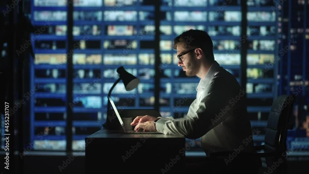 Dedication is what earns the best results. Businessman in office working at desk on laptop. man student writer sit at office desk with laptop thinking of inspiration search problem solution ideas