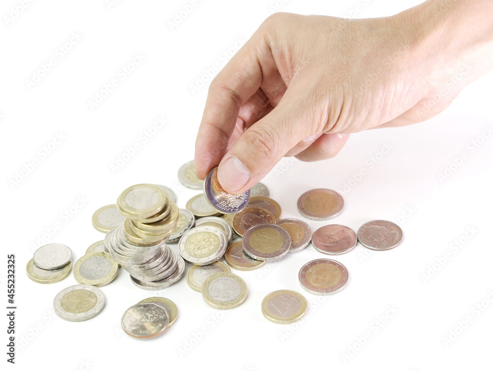 Selective focus of Man Hand Holding Coin in a meaning Income Selective focus of Man Hand Holding Coin in a meaning Income