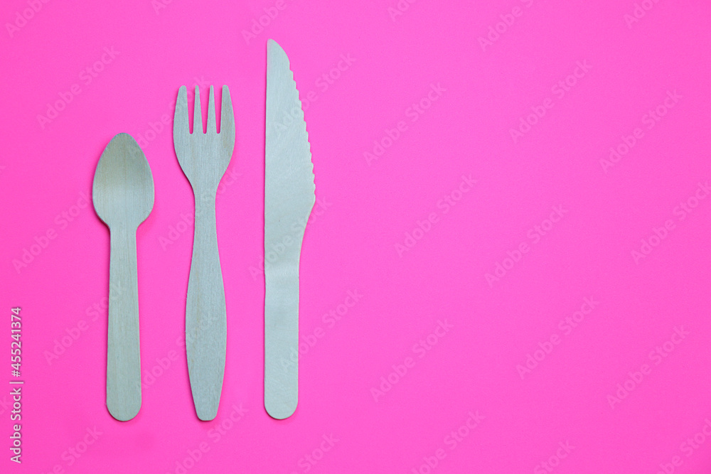 Eco friendly bamboo cutlery set on pink background. Zero waste concept. Eco friendly bamboo cutlery set on pink background. Zero waste concept.