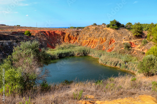 The bauxite quarry of Otranto, now abandoned. Bauxite is a mineral used to produce aluminum. Salento, Puglia, Italy