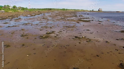 Low tide coast aerial drone footage, eco tourism and ecology Solovki Russia 4K