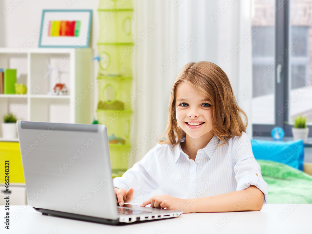 education, school and technology concept - happy smiling student girl with laptop computer learning online over home room background education, school and technology concept - happy smiling student girl with laptop computer learning online over home room background