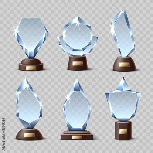 Crystal winners awards. Realistic glass trophies, different shapes, transparent acrylic mockups, geometric bases with plaques. Vector set