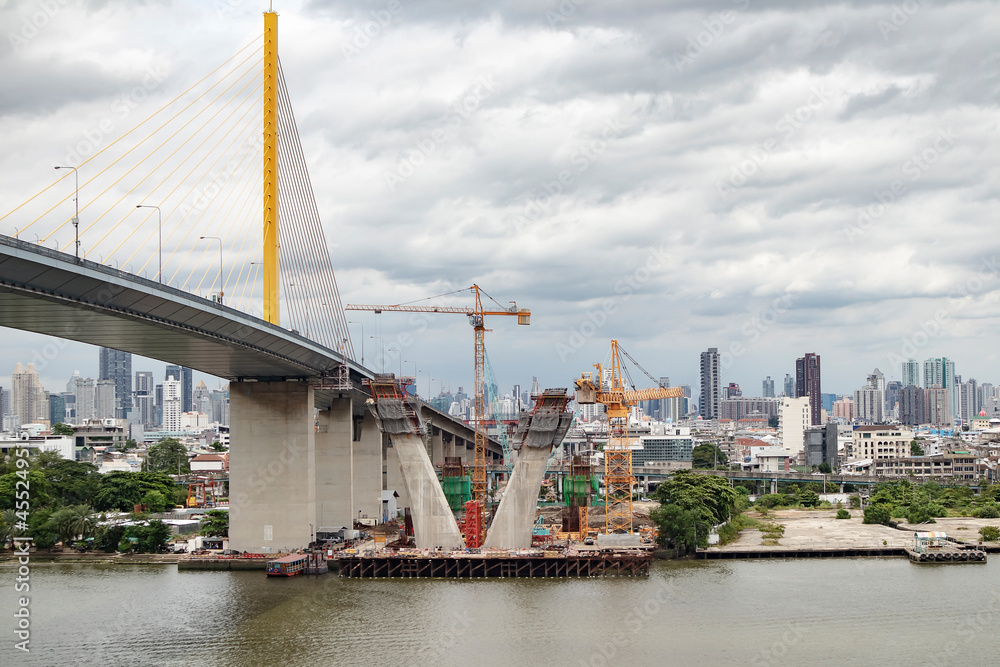 Fototapeta premium The back of a tower crane in Thailand taken on the side of the Chao Phaya River.
