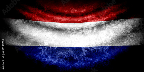Obraz na plátně Netherlands dark wavy flag in grunge style with darkened edges