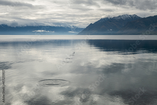 Skimming rocks on Lake Hawea in Otago, New Zealand