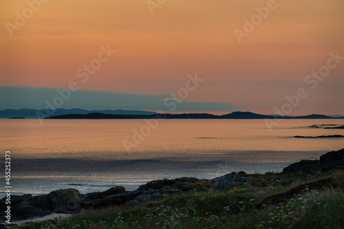 Sunset on the Mull of kintyre looking at the Isle of Islay in Argyll and Bute  Scotland