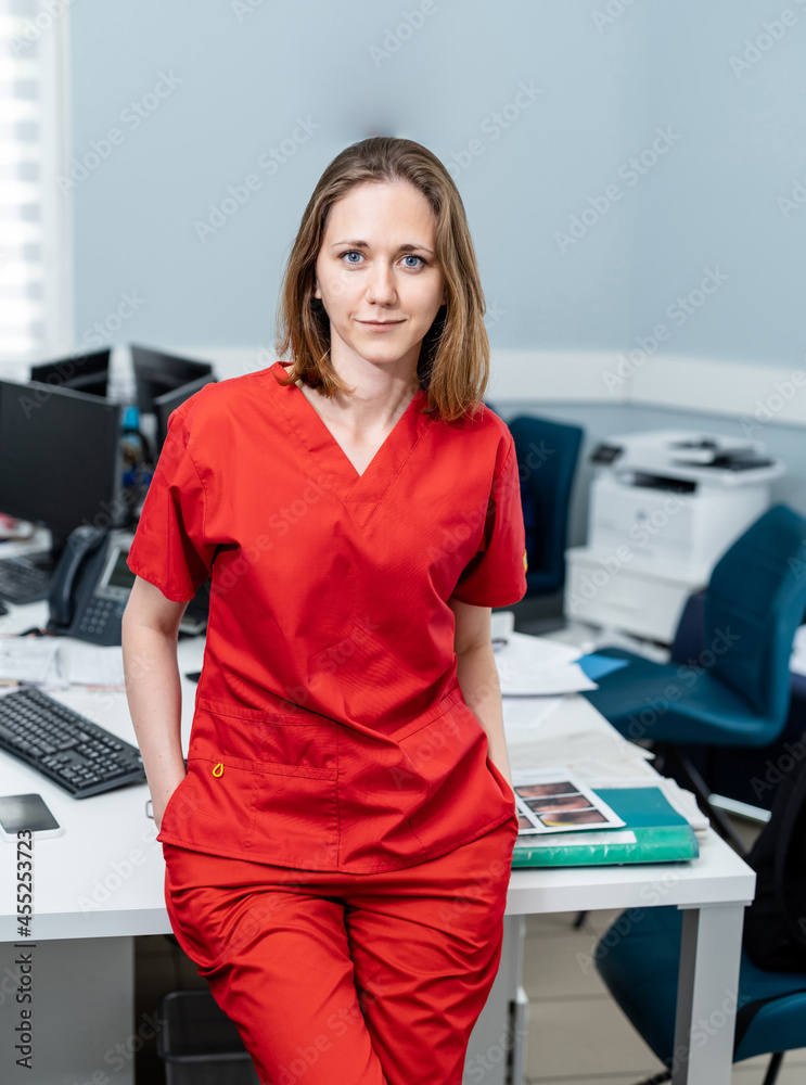 Attractive female doctor looking into camera. Pretty young doctor posing for camera. Attractive female doctor looking into camera. Pretty young doctor posing for camera.