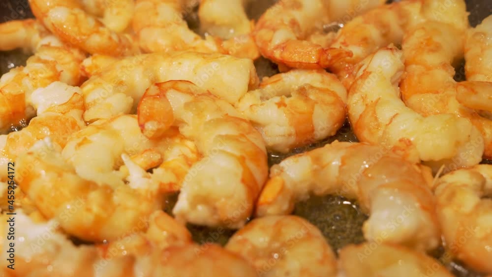 Delicious and Healthy Peeled Large Shrimp Are Cooked, Fried, Steamed. Healthy Sea Food, Seafood, Shrimp Cooking, Close-up. Asian Cuisine. Delicious and Healthy Peeled Large Shrimp Are Cooked, Fried, Steamed. Healthy Sea Food, Seafood, Shrimp Cooking, Close-up. Asian Cuisine.