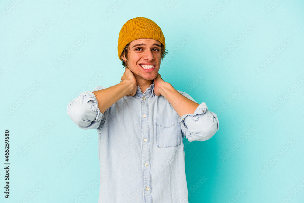 Young caucasian man with make up isolated on blue background touching back of head, thinking and making a choice. Young caucasian man with make up isolated on blue background touching back of head, thinking and making a choice.