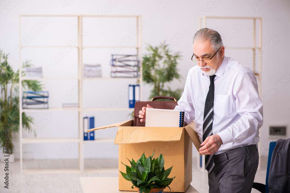 Old male employee in dismissal concept Old male employee in dismissal concept
