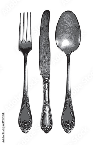 Set of realistic fork, spoon and knife in retro style. Vintage silverware or flatware vector illustration. Beautiful silver or steel cutlery top view isolated on white background. Old tableware photo