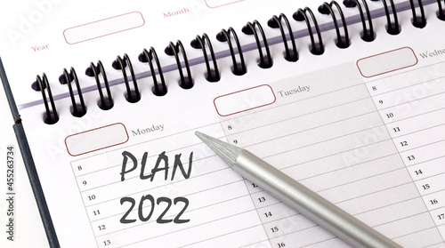 PLAN 2022 on the planner with pencil, business