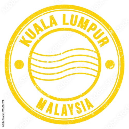 Canvas Print KUALA LUMPUR - MALAYSIA, words written on yellow postal stamp