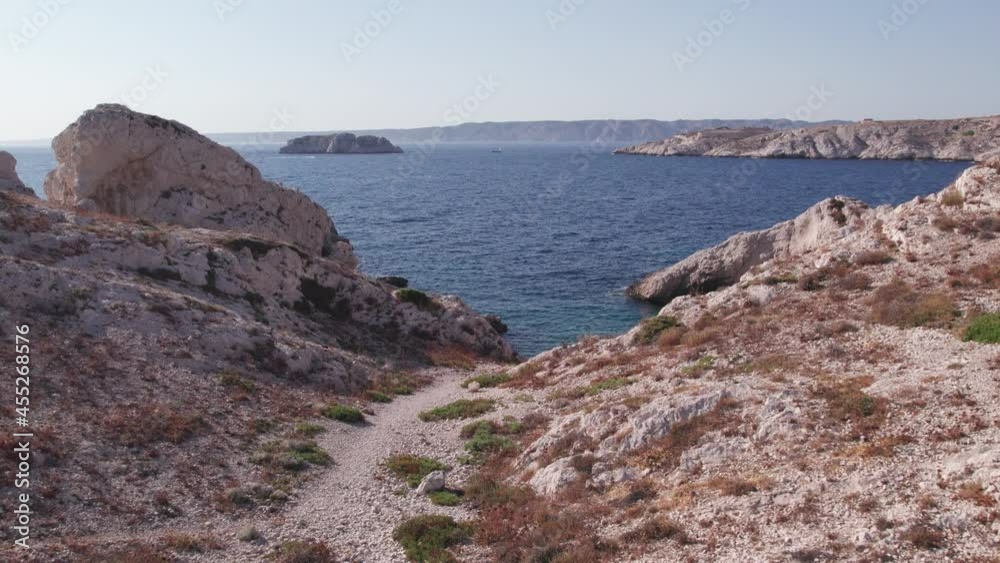 Rocky trail to clear waves of the Mediterranean, edge of Marseile, France -Aerial Rocky trail to clear waves of the Mediterranean, edge of Marseile, France -Aerial