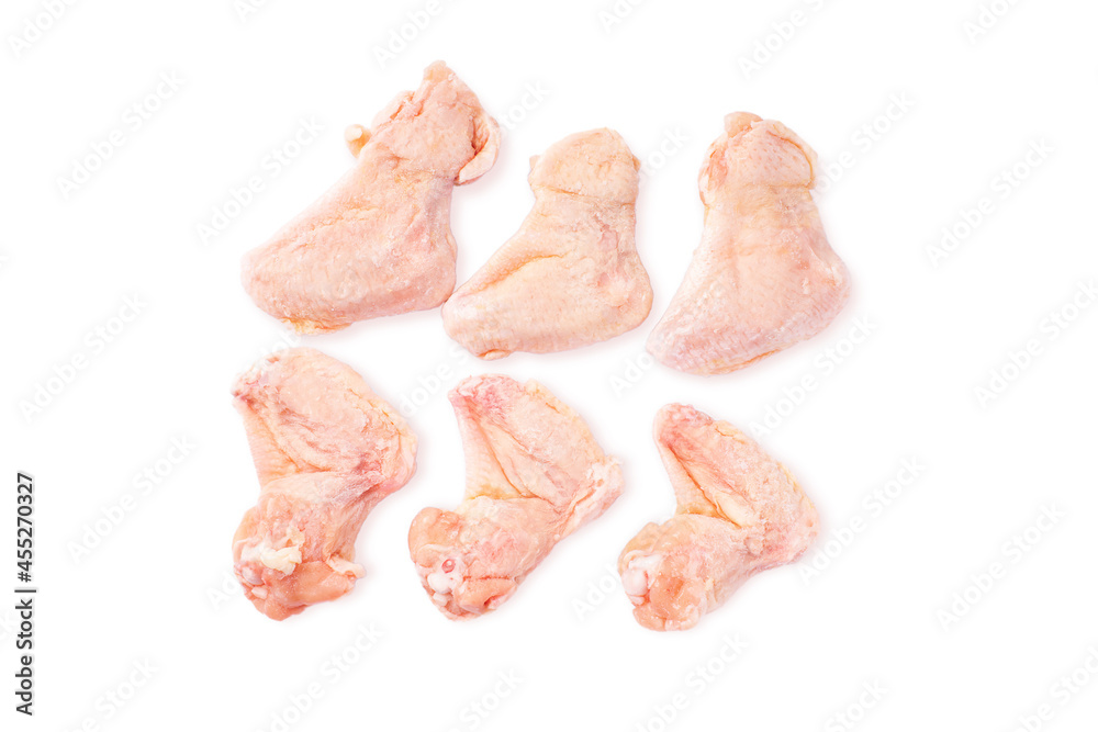 Raw wings on a white background, isolade. Raw frozen wings for a supermarket. Raw wings on a white background, isolade. Raw frozen wings for a supermarket.