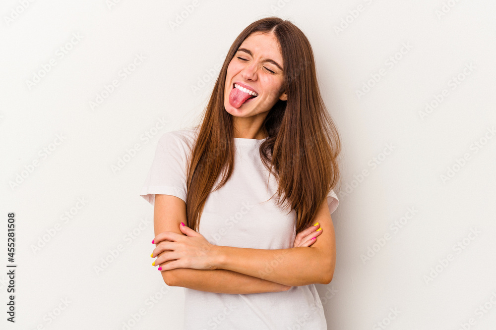 Young caucasian woman isolated on white background funny and friendly sticking out tongue. Young caucasian woman isolated on white background funny and friendly sticking out tongue.