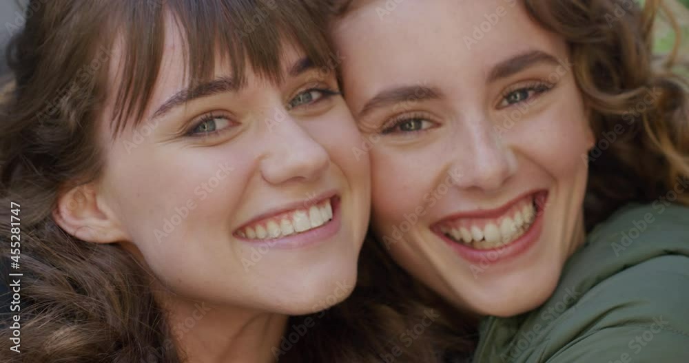 Portrait of two friends hugging Portrait of two friends hugging