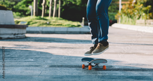Fototapeta Naklejka Na Ścianę i Meble -  Skateboarder skateboarding outdoors in city
