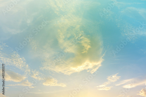 Dramatic sunset sky soft cloudy is gradient pastel, Abstract sky background . Image contain certain grain or noise and soft focus.