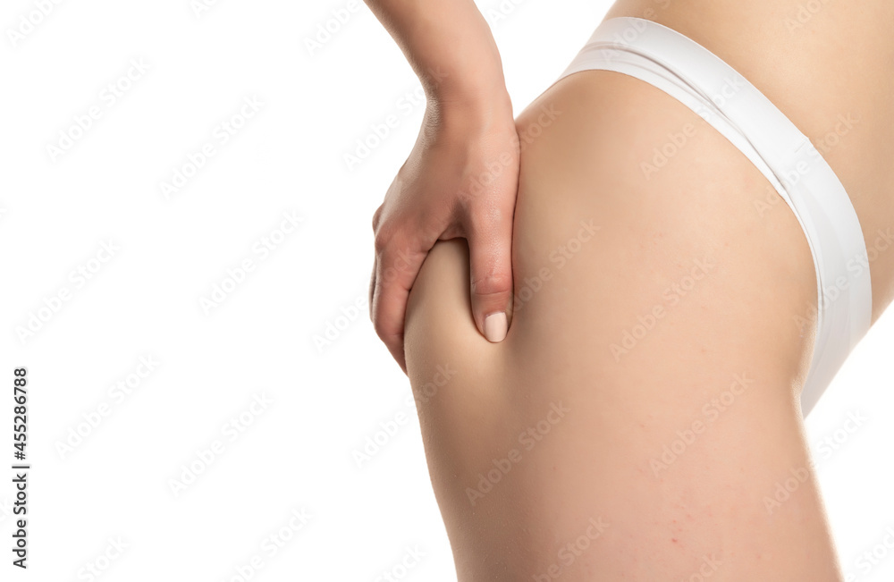 Close up of a woman pinching her buttocks