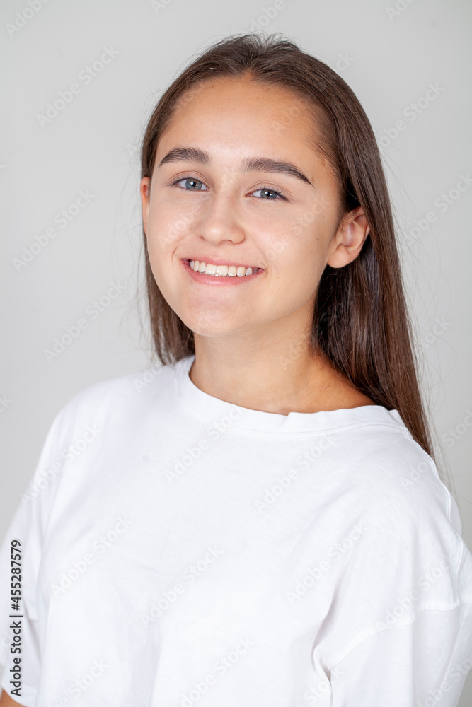 Close up portrait of a young beautiful happy brunette girl