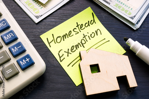 Homestead exemption written on the sticker and model of home. photo