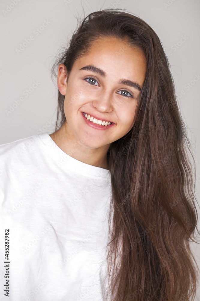 Close up portrait of a young beautiful happy brunette girl Close up portrait of a young beautiful happy brunette girl