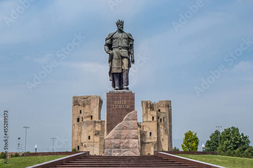 Central historical part of city Shakhrisabz, Uzbekistan. Statue of Timur (Tamerlane), in the distance you can see the gates of the medieval palace Ak Saray photo