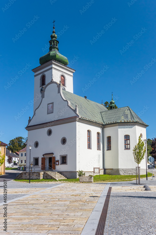 Historic white church on the market square of Volary, Czech Republic
