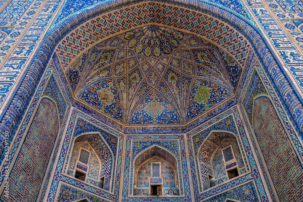 Details of the ornamented portal or iwan, an example of Eastern architecture. Madrasah Tilya Kori in Samarkand, Uzbekistan, XVII century