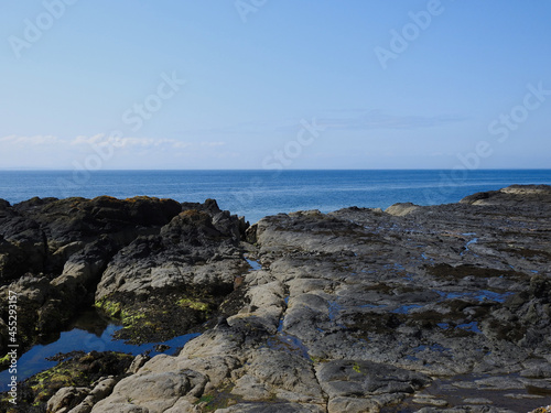 rocks and sea cliff blue sky