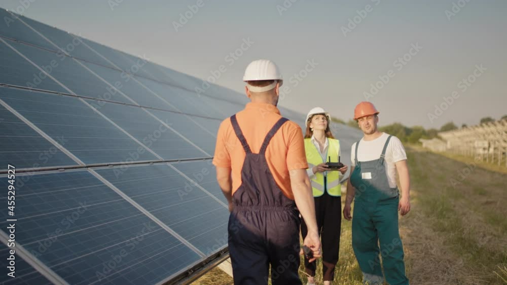 Technician and investor Using Infrared Drone Technology to Inspect Solar Panels and Wind Turbines in Solar cell Farm, Solar cells will be an important renewable energy of the future. Solar panel Technician and investor Using Infrared Drone Technology to Inspect Solar Panels and Wind Turbines in Solar cell Farm, Solar cells will be an important renewable energy of the future. Solar panel