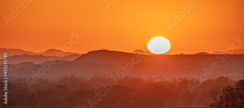 Panorama image of a sunrise in the desert in Namibia