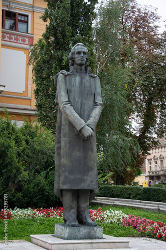 Statue of Mihai Eminescu  Cluj Romania, August, 2021  Avram Iancu Square, in front of The « Lucian Blaga » National Theatre  photo