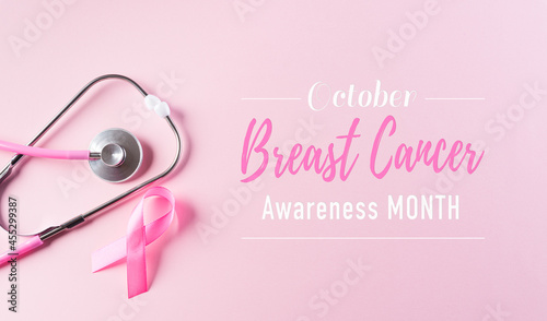 Pink ribbon and stethoscope on pastel pink background, Symbol of womens breast cancer awareness, Health care and medical concept.