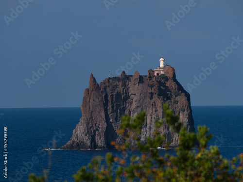 Beautiful view of Strombolicchio lighthouse in the se photo