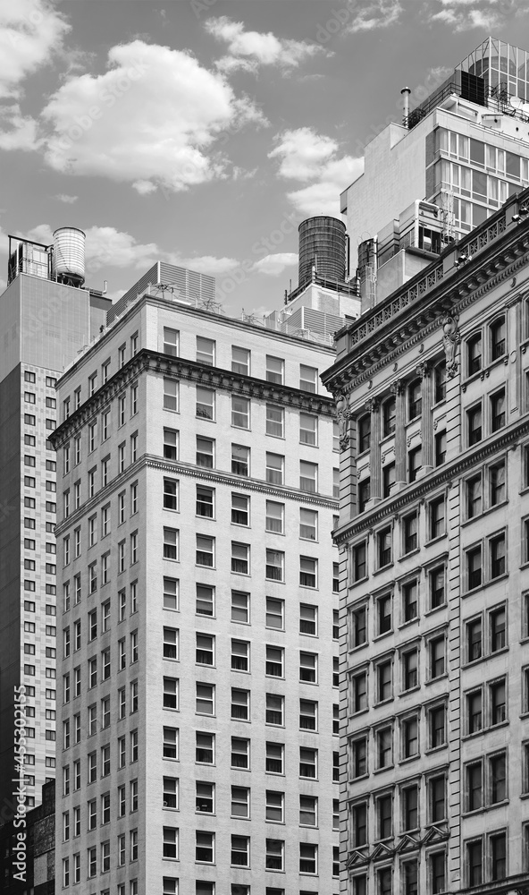 Black and white photo of New York old buildings, USA.