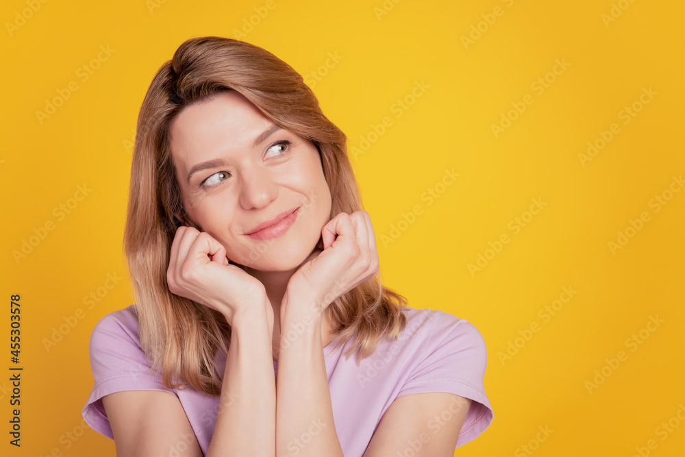 Portrait of lovely adorable cute dreamy lady look blank space imagine ideas on yellow background Portrait of lovely adorable cute dreamy lady look blank space imagine ideas on yellow background