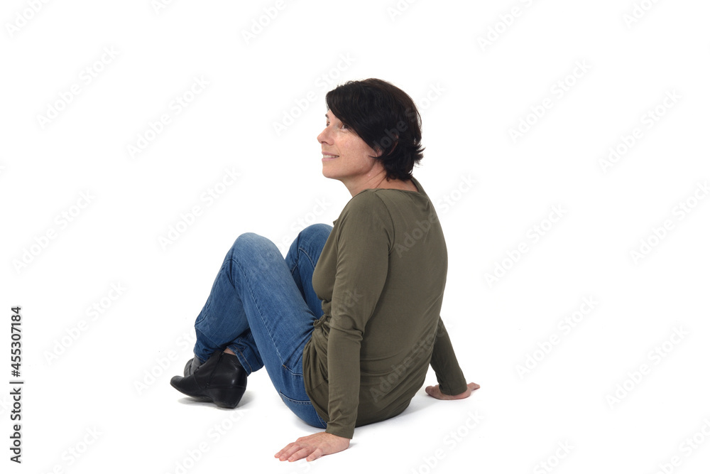view of a woman sitting on white background view of a woman sitting on white background