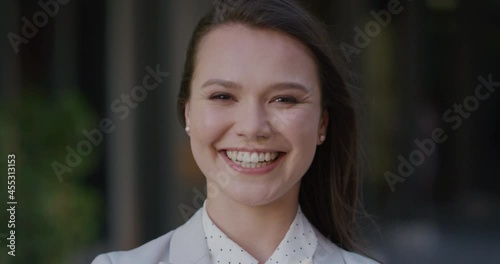 Portrait beautiful business woman smiling outdiirs in city happy about success in life photo