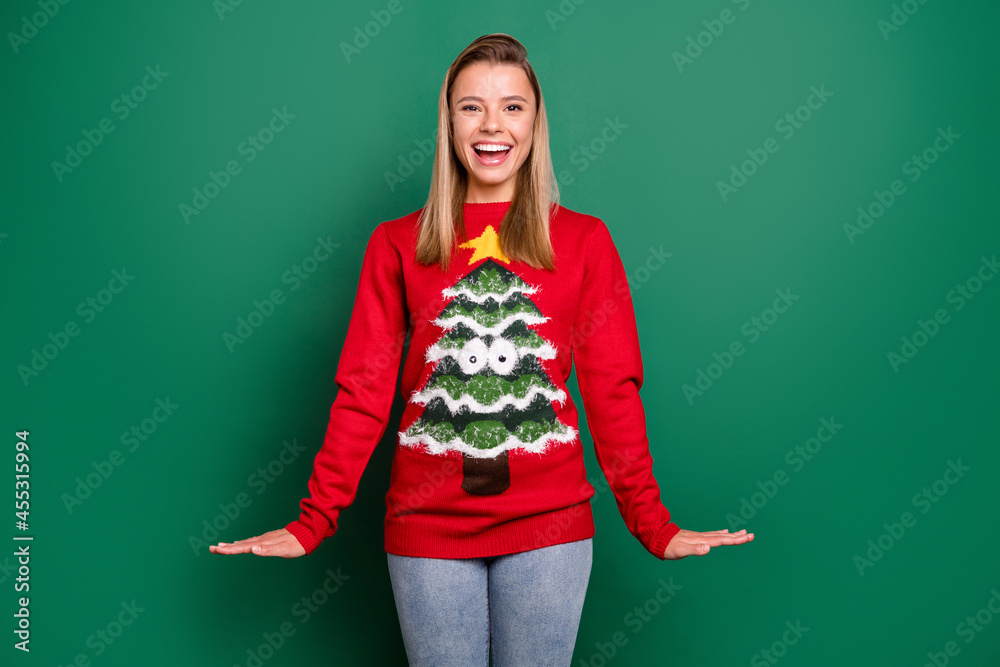 Portrait of attractive cheerful girl wearing cozy casual jumper having fun good mood isolated over green color background Portrait of attractive cheerful girl wearing cozy casual jumper having fun good mood isolated over green color background