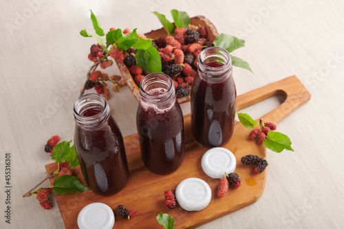 Mulberry Shrub, Juice or liqueur in glass bottles, mulberry juice for health, reduce cholesterol, control blood sugar, antioxidants, nourish the brain, cancer prevention, stimulates blood flow.