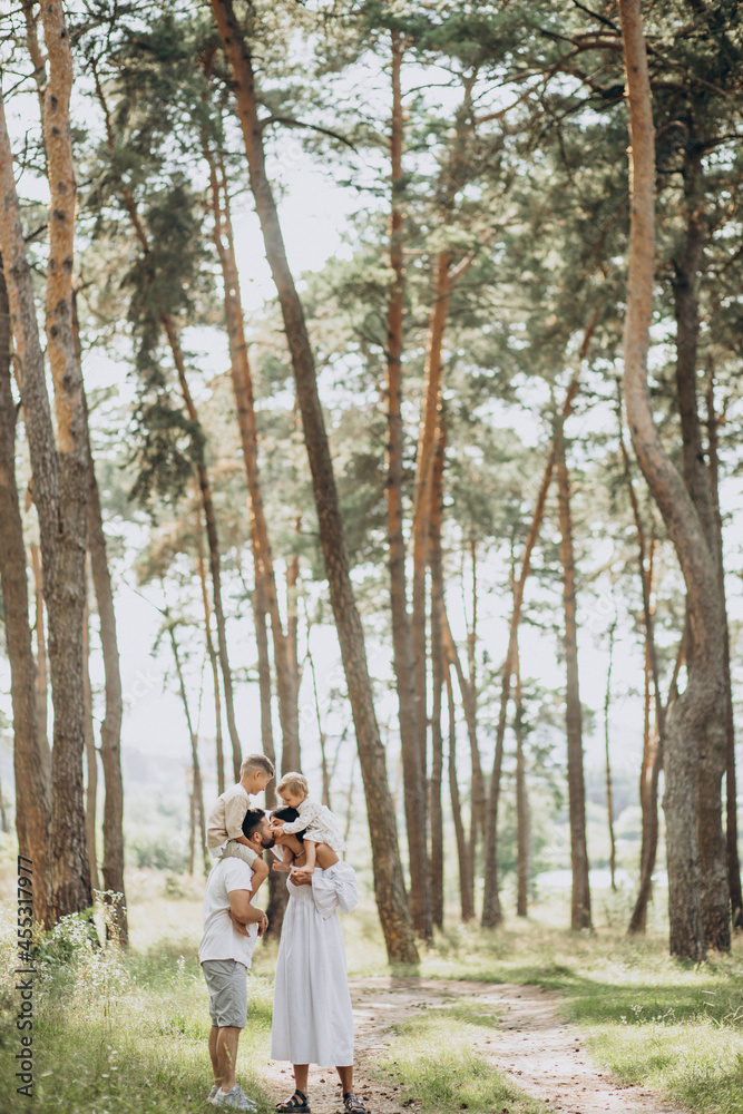 Fototapeta premium Family with baby daughter and little son in park