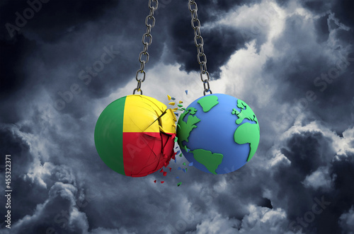 Benin flag ball smashing into planet earth. Global impact and disaster concept. 3D Render © ink drop